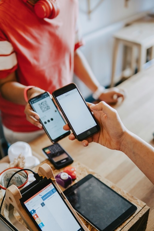 A mobile phone scanning a QR code